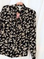 BLUSA FLORAL CUELLO V